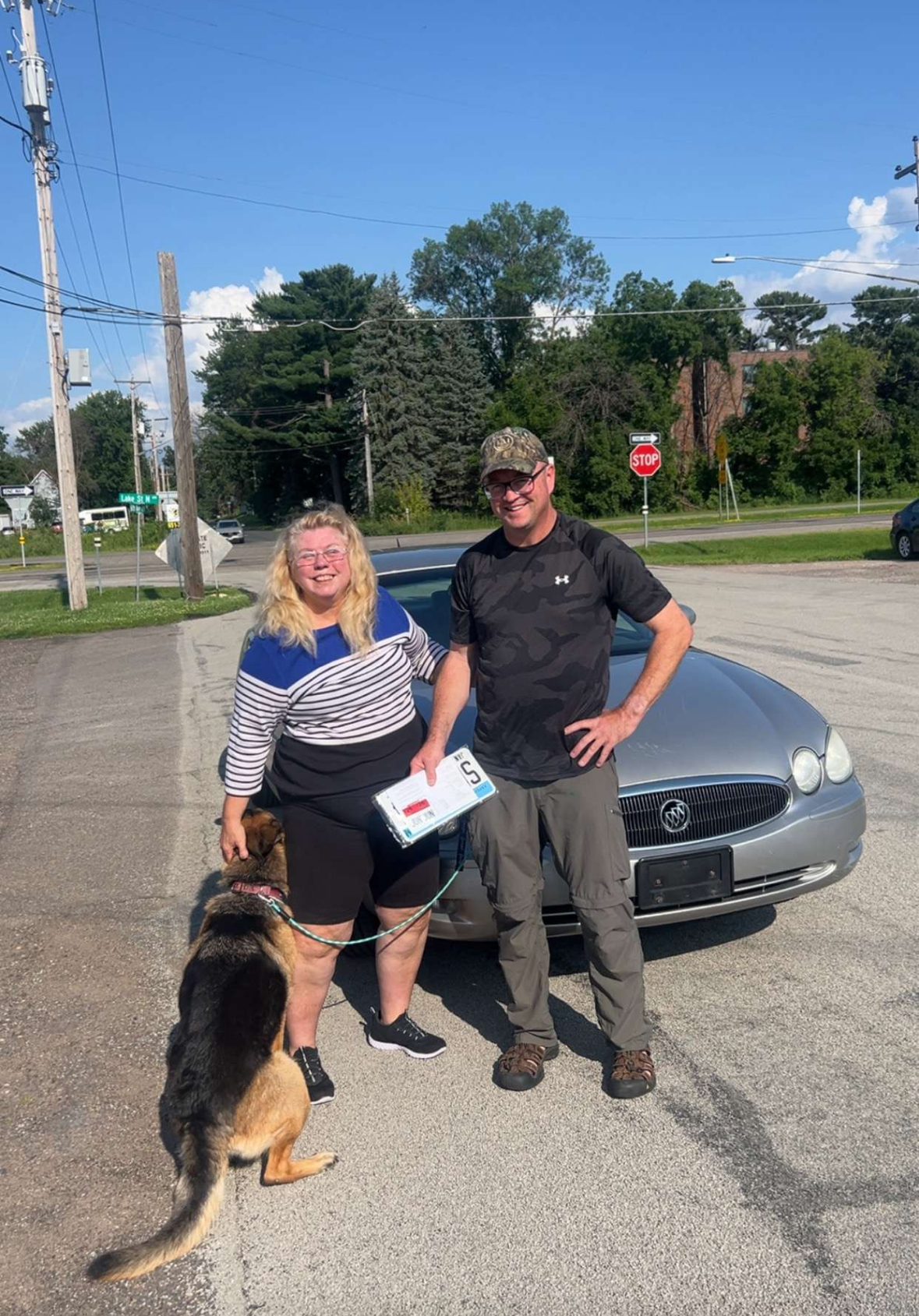 Happy customer with their vehicle