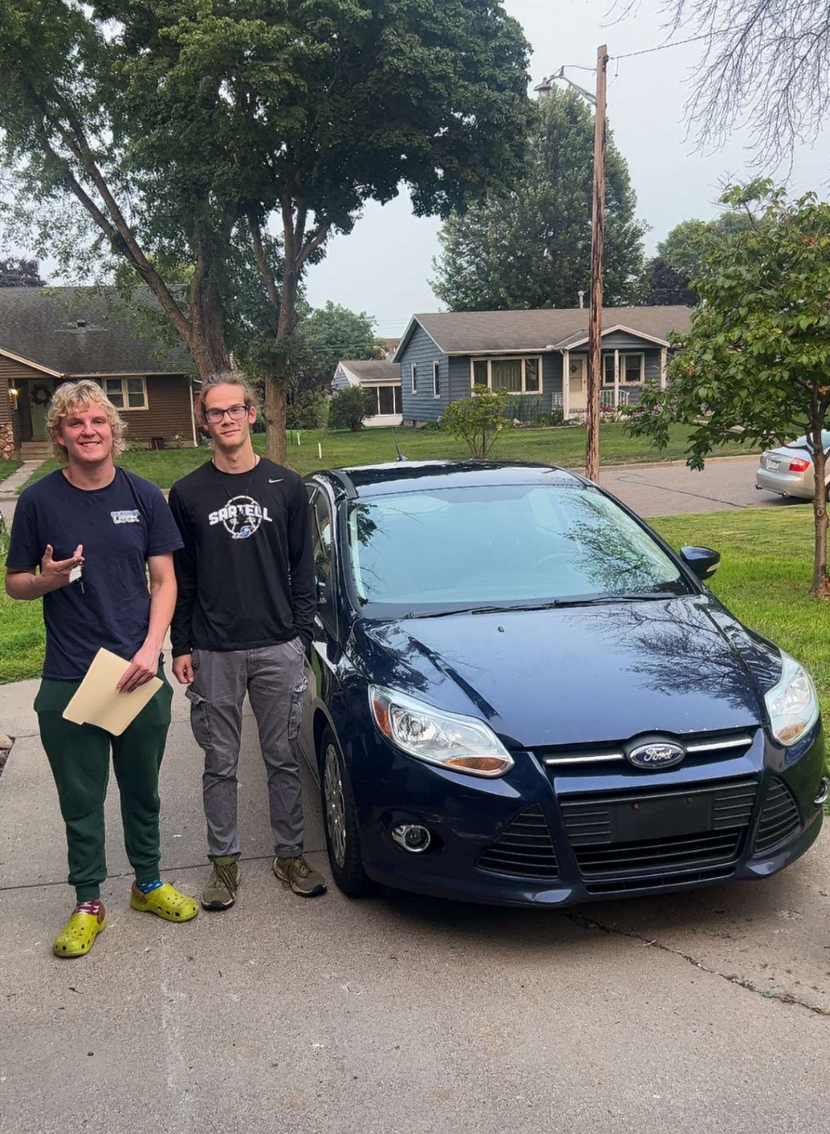 Happy customer with their vehicle