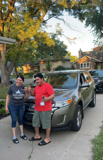 Happy customer with their vehicle